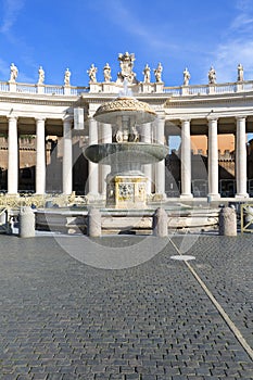 Colonnade and fountain on St.Peter`s Square in front of Saint Peter`s Basilica. Deserted square due to the Covid-19 coronovirus