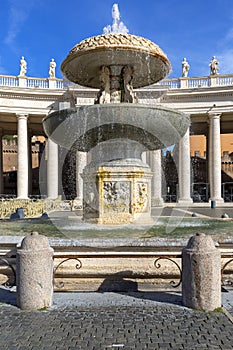 Colonnade and fountain on St.Peter`s Square in front of Saint Peter`s Basilica. Deserted square due to the Covid-19 coronovirus