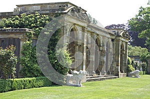 Colonnade and lion statues at Hever castle Italian garden in England