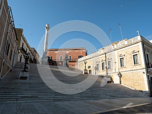 Colonne Romane column in Brindisi, Italy with famous Scalinata Virgilio staircase photo