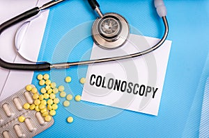 Colonoscopy word written on medical blue folder
