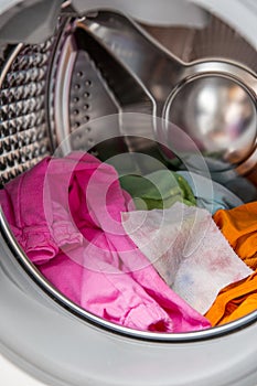 Color absorbing sheet inside a washing machine.