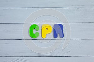 Color alphabet in word CPR abbreviation of Cardiopulmonary resuscitation on white wood background