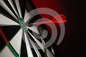 Color arrow hitting target on dart board