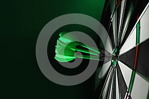 Color arrows hitting target on  board against green background