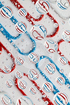 Color background with water drops and paper clips