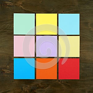 Color bar from paper sticker on wood background in square frame form . Flat design and top view of interface menu concept on desk.