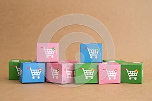 Color carton boxes with drawing of trolley or shopping cart. Ecommerce, online shopping, COD Cash On Delivery service concept.