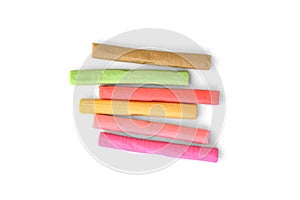 Color chewable candy sticks isolated on a white background.