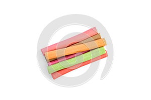 Color chewable candy sticks isolated on a white background.