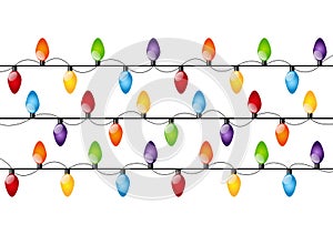 Color Christmas light bulbs on white