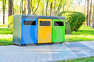 Color coded garbage bins in a public park