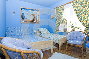 Color coordinated blue bedroom photo