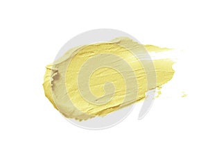 Color corrector stroke isolated on white background. Yellow banana color correcting cream concealer smudge photo