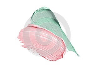 Color corrector strokes isolated on white background. Green and pink color correcting cream concealer smudge smear swatch sample