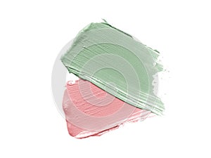 Color corrector strokes isolated on white background. Green and pink colour correcting cream concealer smudge