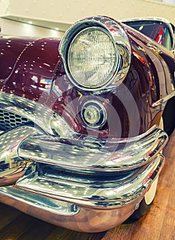 Color detail on the headlight of vintage american car.