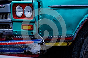 Color detail on the headlight of a vintage car