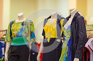 Color dresses and suits on mannequins in mall