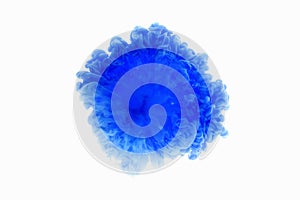 Color drop in water, photographed in motion. Abstract swirling. Cloud of silky bulb under water isolated on white background. Blue