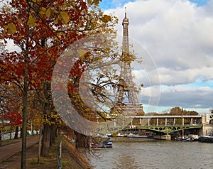 Color fall image of the Eiffel tower in Paris, France, Europe, on a sunny autumn day .