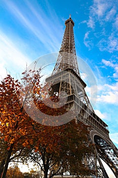 Color fall image of the Eiffel tower in Paris, France, Europe, on a sunny autumn day .