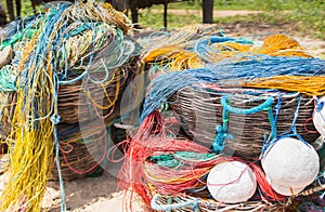 Color fishing net, floats, nylon rope in the basket on the bank