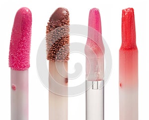 Color gloss lipstick brushes isolated on white