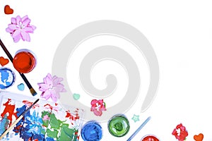 Color gouache jars on white background. Top view, copy space