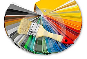 Color guide fan chart catalog spectrum of all kind of various colors to choose paint from book brush on it. DIY renovation home