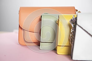 Color handbags on the pink background