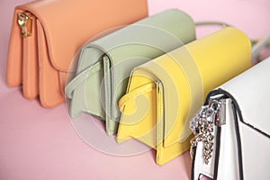 Color handbags on the pink background