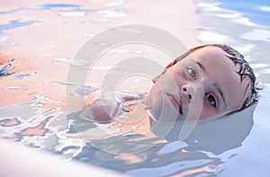 Color image of a boy swimming