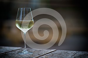 Color image of chilled white wine in a glass , with copy space.