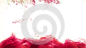 Color ink drop in water. carmine red, green, dark red