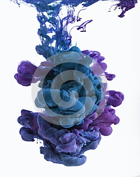 Color ink drop in water. Cyan, blue violet.