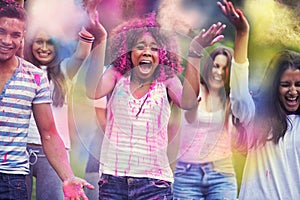 Color me excited. Portrait of a group of friends having fun outdoors at a color festival.