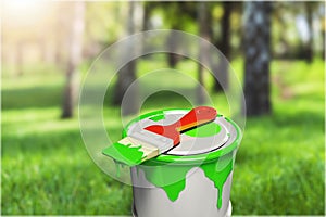 Color paint can on nature background