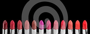 Color palette. Set of lipsticks isolated on black background