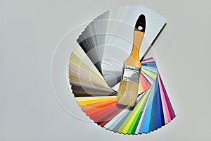 Color palette swatches with paint brush. Palette of different colors and shades on white background. Color catalog for tinting