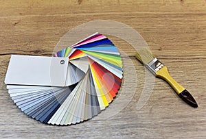 Color palette swatches with paint brush. Palette of different colors and shades on white background. Color catalog for tinting