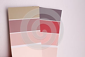 Color palette with various samples. Light background. Paint selection cards, close-up.