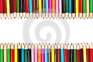 Color palette wooden crayon pencils at white background