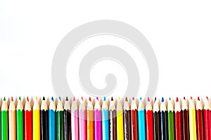 Color palette wooden crayon pencils at white background