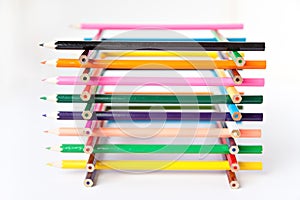 Color palette wooden crayon pencils at white background