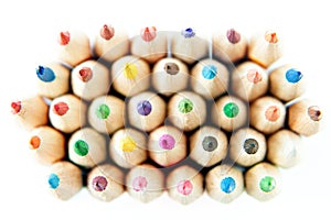 Color palette wooden crayon pencils at white background