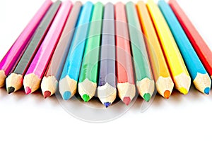 Color palette wooden crayon pencils at white background