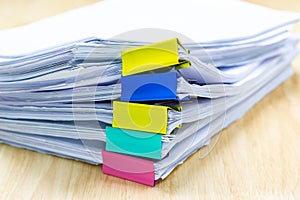 Color paper clip with Stack of papers documents