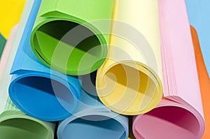 Color paper rolled and piled.