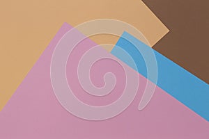 Color papers geometry composition background with beige, brown pink and light blue tones